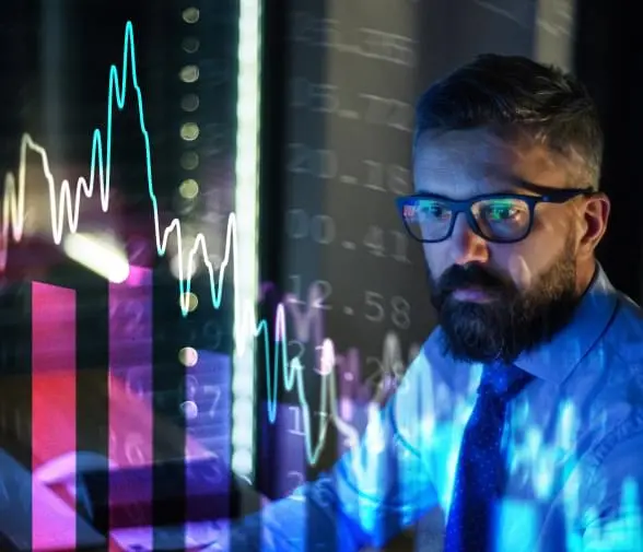 Analyst reviewing real-time charts and strategy data with PryLuxo